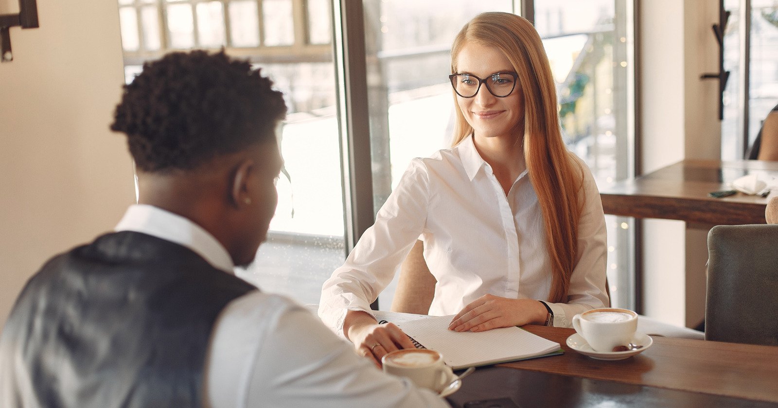 If a woman feels attracted to you, she’ll almost always display these body language gestures (without realizing it)
