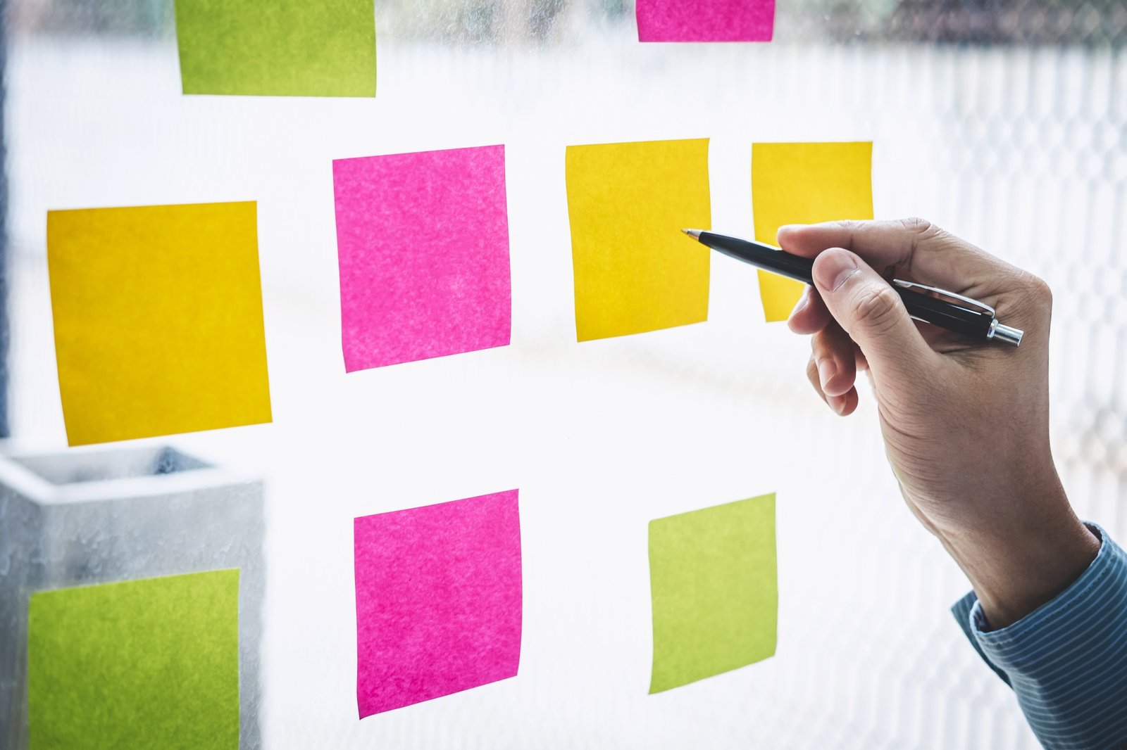 Businessman use post it notes to planning idea and business marketing strategy