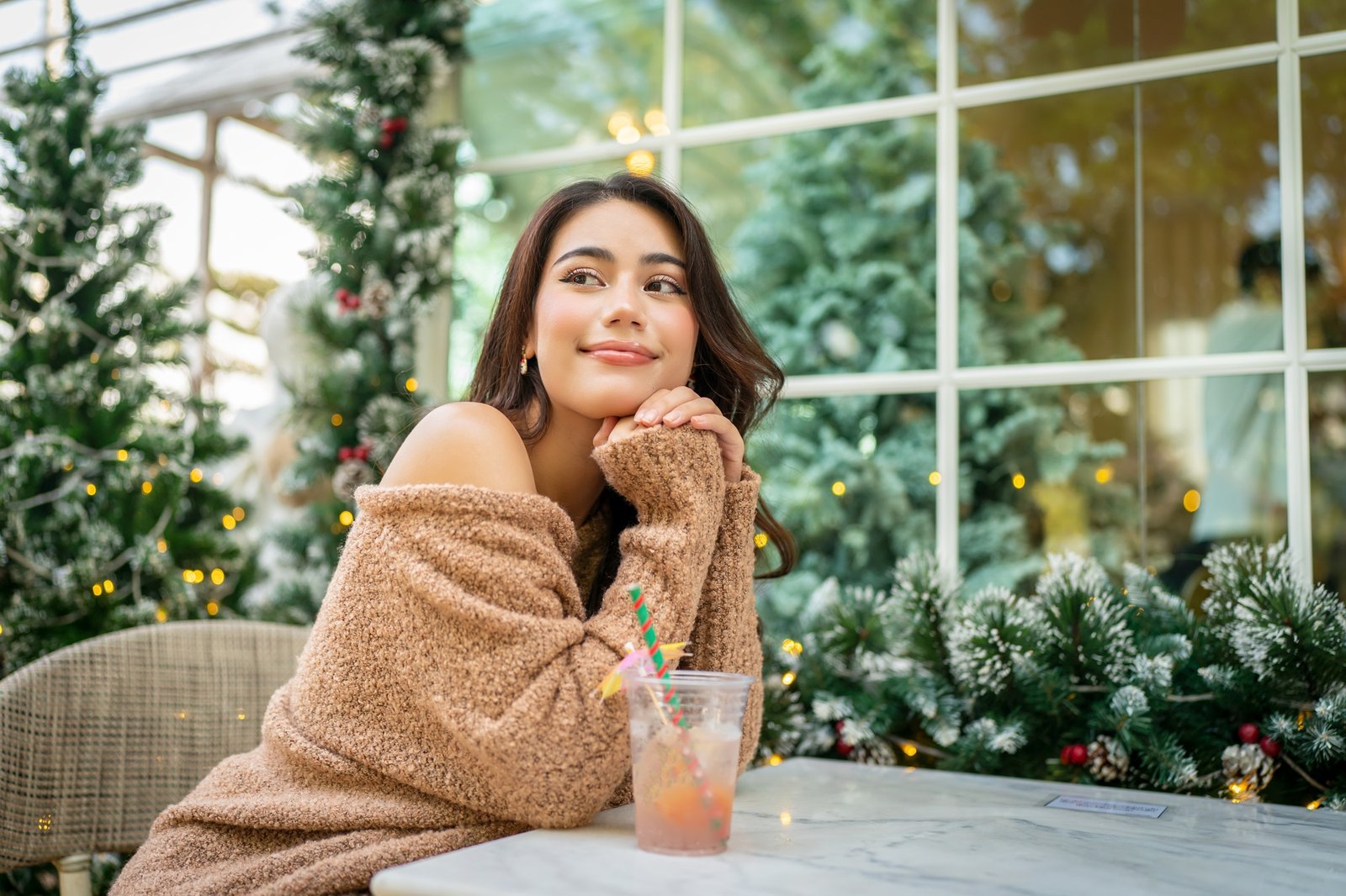 Christmas time. relaxed elegant young woman with Santa custom in red dress Christmas time.