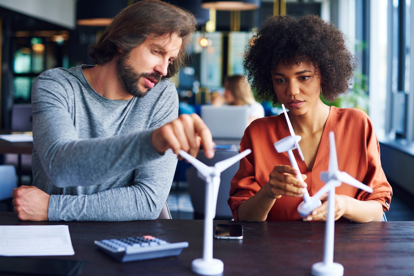 Focused business couple exchanging their ideas