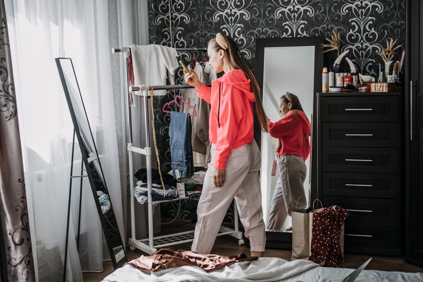 Online resale consignment and thrift store. Buy and sell secondhand clothes. Young woman