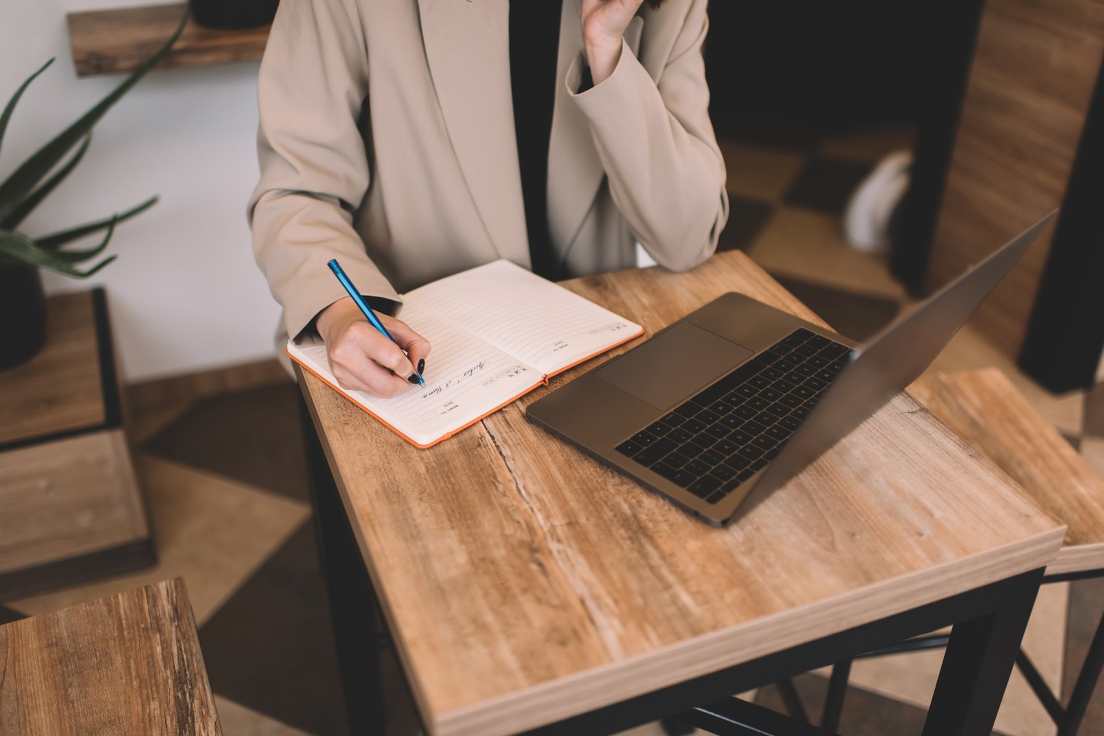 Cropped image of businesswoman working in cafe