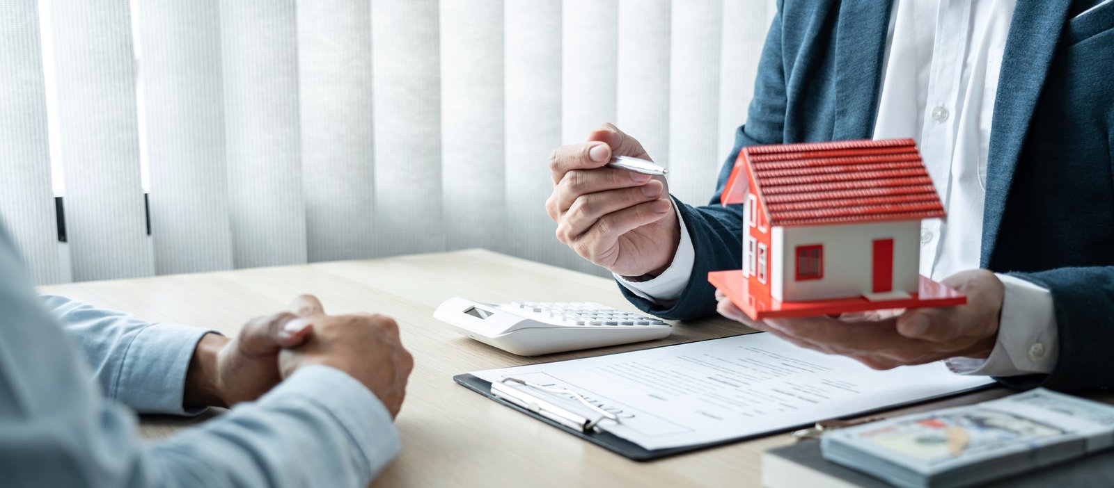 Real estate broker agent consulting the customer to a decision making sign insurance form contract