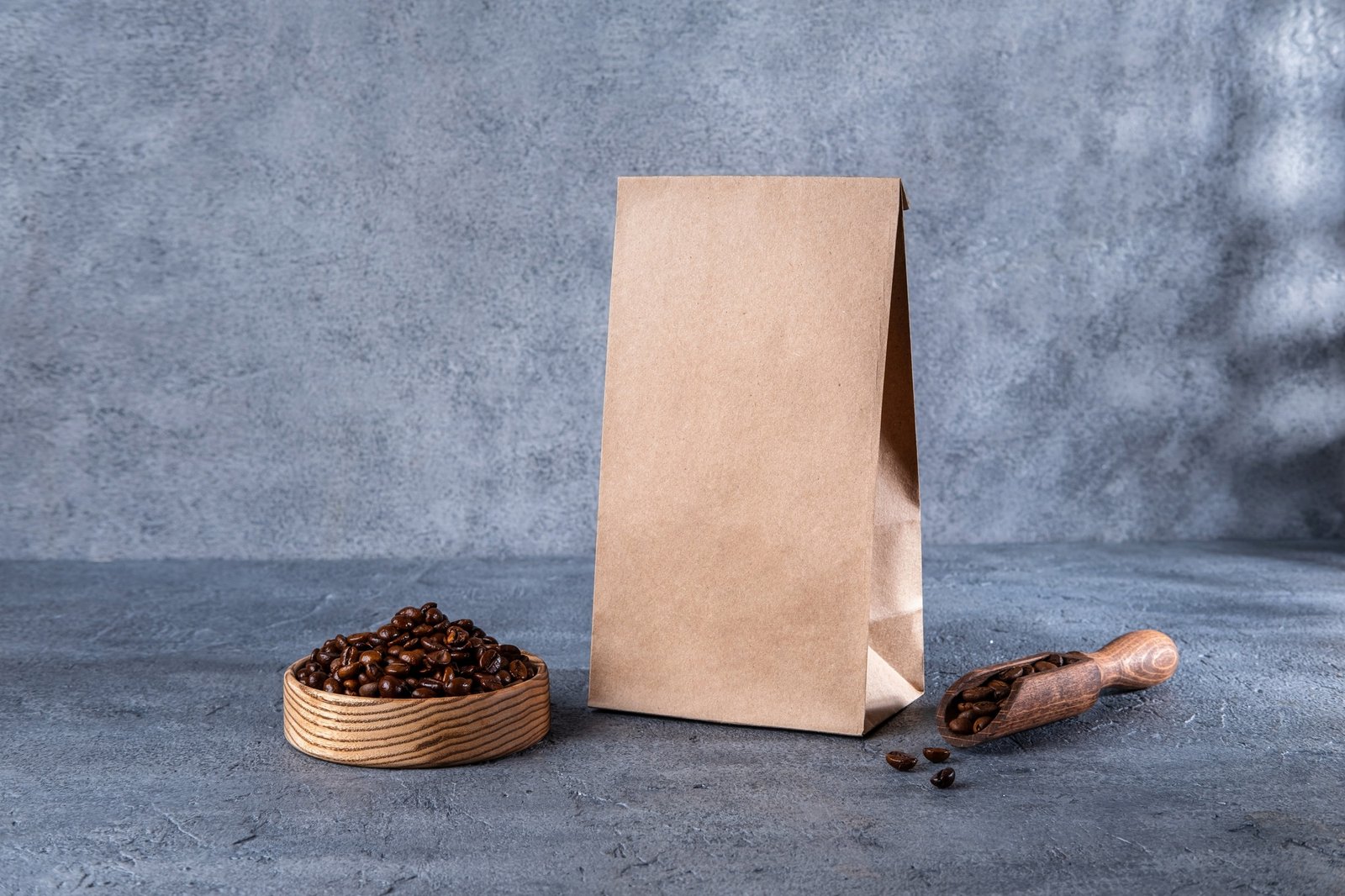 Coffee identity branding mockup. Blank brown craft bag with coffee beans.