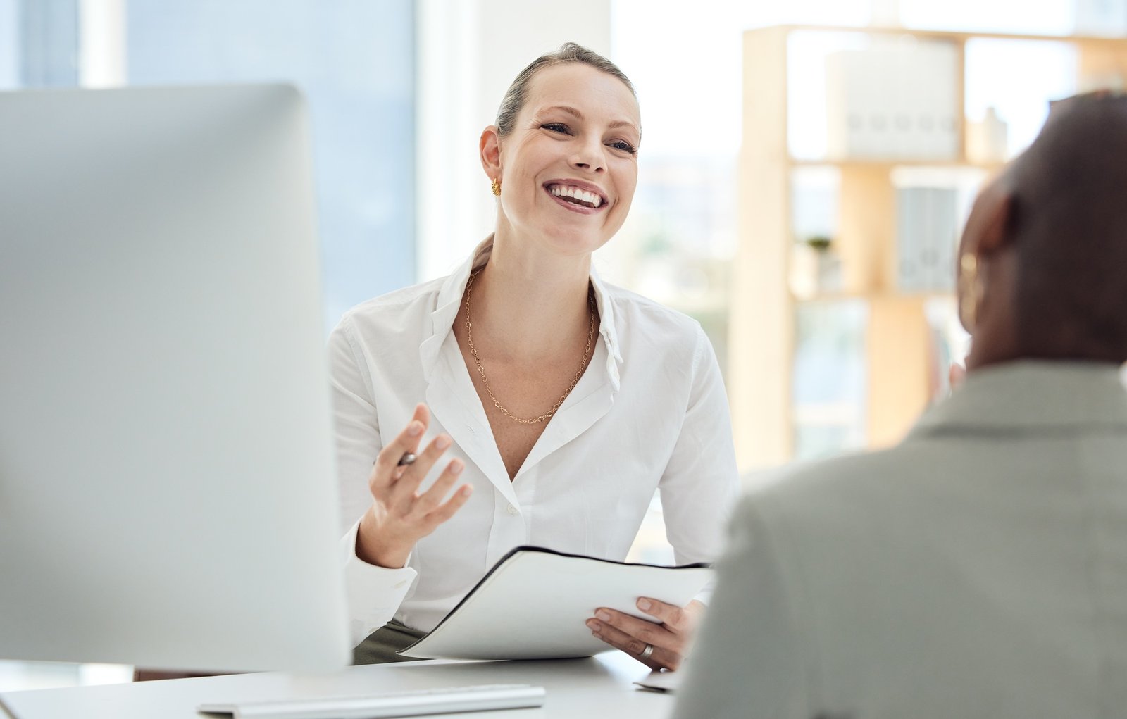 Recruitment, interview and hr professional talking to a new employee for onboarding with cv or hiri